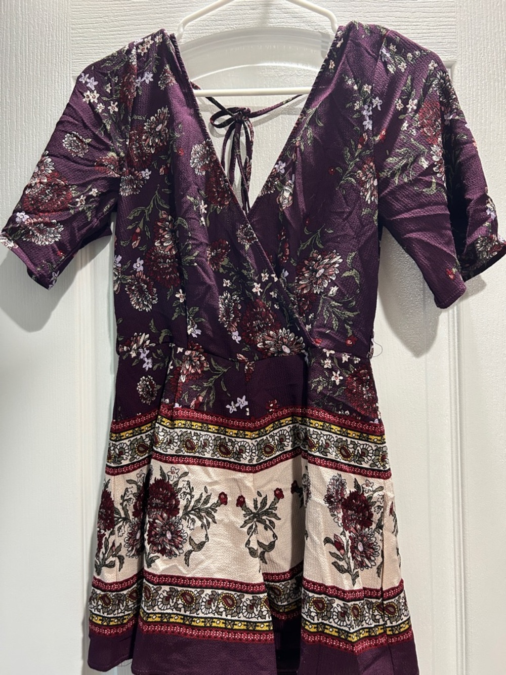 Francesca's Collections Plum Floral Wrap Romper with Cream Border